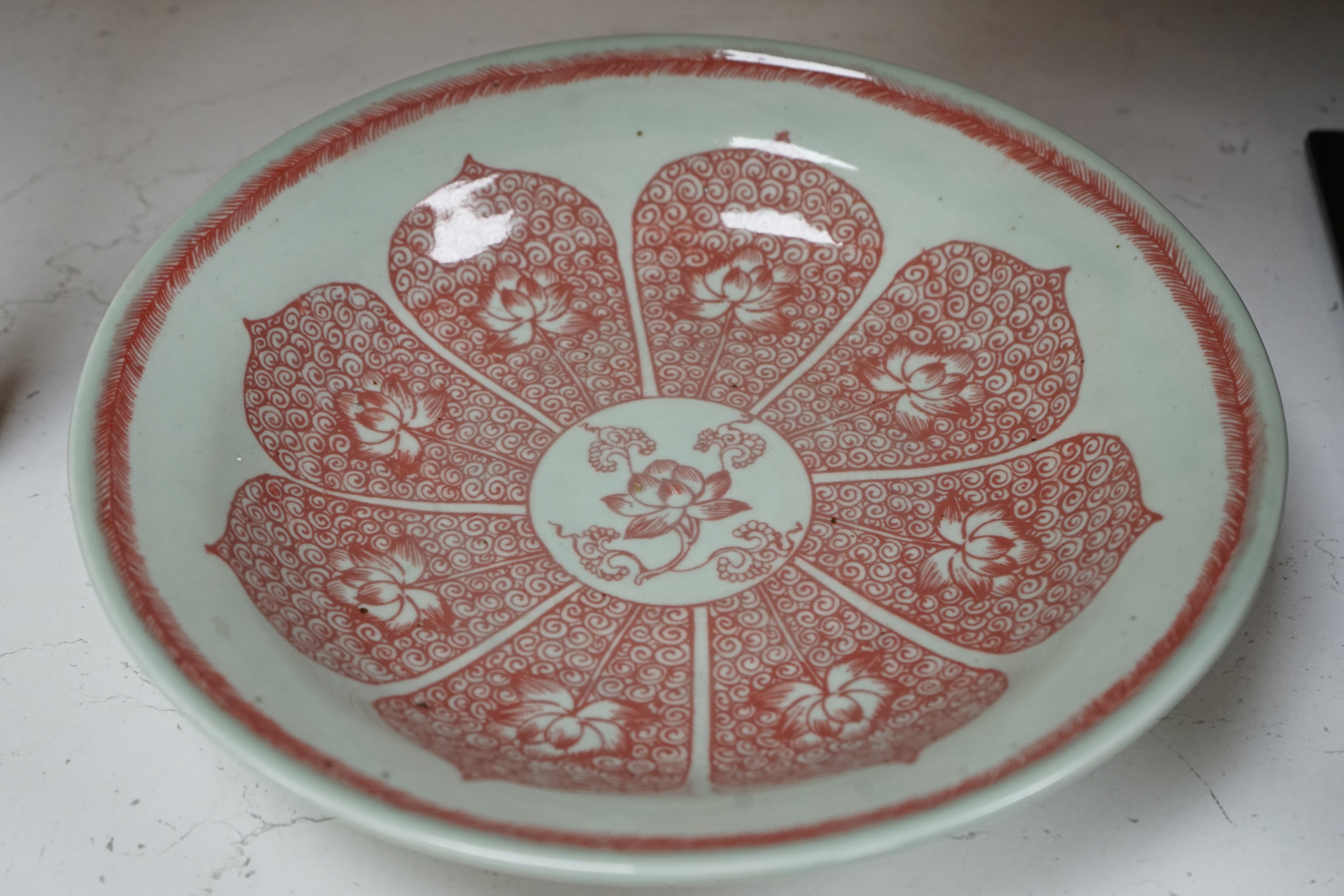 A Chinese underglaze copper red dish, 27cm diameter., Condition - good